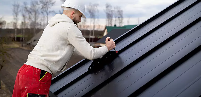 Tin Roof Ridge Cap Installation in Waukegan
